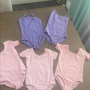Bundle of pink and purple ballet leotards